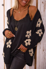 Orange floral knit cardigan with high-stretch shift silhouette