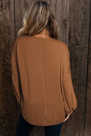 Waffle knit button-neck top in a relaxed shift silhouette