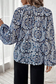Tribal print blouse showing frilled lace-up neckline detail
