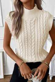 Chunky cable knit vest styled as a cozy layering piece