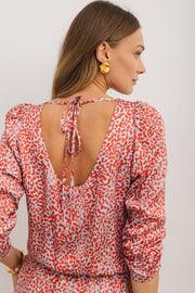 Leopard print long sleeve mini dress showing daring hollow open back