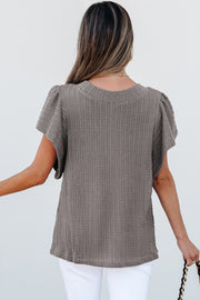 Cable-knit flutter sleeve top with short feminine sleeves