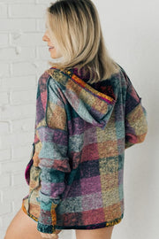 Oversized plaid hoodie showing loose shift silhouette