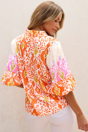 Leopard colorblock blouse showing short puff sleeves