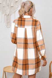Button-up front detail on khaki plaid shirt dress