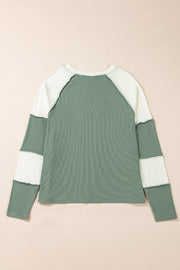 Colorblock raglan top with exposed hemline detailing