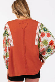 Desert Gold Floral Blouse showing round crew neckline and loose shift silhouette