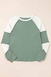 Mint green crew neck pullover in stretchy ribbed fabric