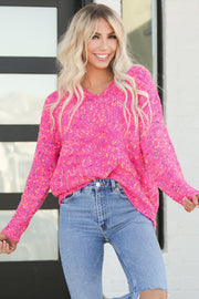 Business casual spotted knit sweater layered under a coat