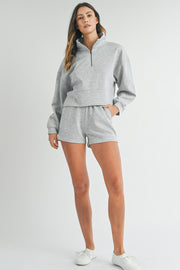 Coordinating light grey sweatshirt and shorts set for everyday wear