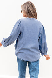 Denim bow tie top showing pintuck bust detail and round neckline