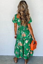 Green floral midi dress showing smocked high waist and fitted bodice