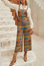 Multicolour boho floral jumpsuit with wide-leg pants and crossed adjustable straps