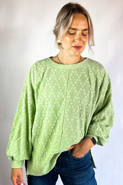 Textured long sleeve crew neck blouse with dropped shoulders