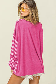 Checkerboard and stripe patchwork blouse showing voluminous lantern sleeves