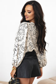 Beige balloon sleeve blouse showing bracelet-length sleeves