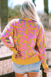 Oversized abstract print knit sweater with round neckline and long sleeves