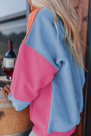 Colorblock sweatshirt showing relaxed oversized fit