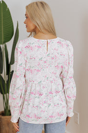 Pink floral babydoll blouse showing keyhole back opening detail