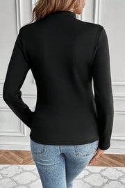Black thermal lined long sleeve tee showing high mock neck coverage