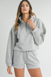 Light grey sweatshirt with structured stand collar and smooth zip front