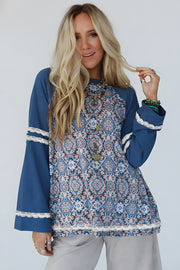 Blue Geometric Long Sleeve Top with loose long sleeves and stretch fabric