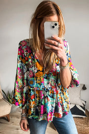 Bubble sleeve floral blouse highlighting trendy bracelet-length sleeves