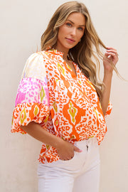 Orange leopard blouse with relaxed shift silhouette