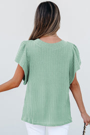 Textured flutter sleeve blouse showing shirred relaxed shift fit