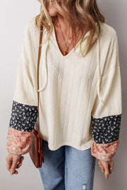Textured knit V-neck blouse with adjustable drawstring neckline in beige