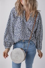 Blue floral puff sleeve blouse with long puff sleeves and relaxed shift fit