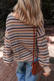 Striped knit sweater showing relaxed shift silhouette