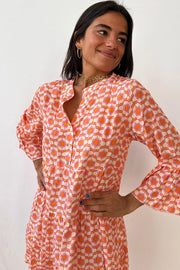 Orange floral print A-line mini dress for warm-weather wear