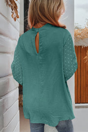 Swiss dot balloon sleeve blouse showing gathered elastic cuffs