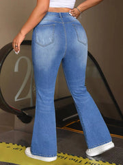 Light blue vintage wash flare jeans with zipper fly closure