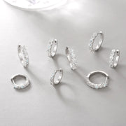 Gold-plated 925 silver huggie hoops with signature moissanite fire