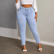 Plus size skinny jeans tapered to a full-length hem