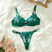 Green lace lingerie set with sheer floral-embroidered bodysuit and adjustable straps