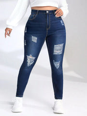 Navy distressed skinny jeans with torn, lived-in detailing