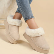 Women's winter snow boots showing thick grippy rubber outsole