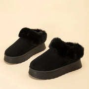 Women's plush-lined snow boots in black, slip-on style