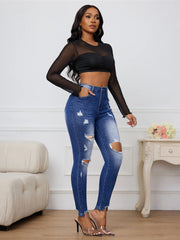 Casual dark blue denim jeans with lived-in stone wash detailing