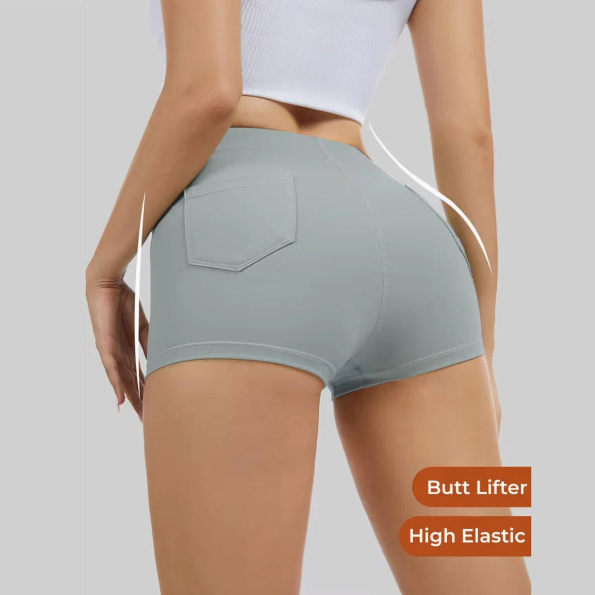 Women's butt-lifting yoga shorts with side pockets in a solid color