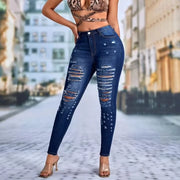 Navy stone-wash high waist skinny jeans with distressed detailing