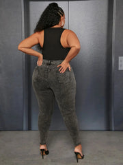 Gray high-rise pencil jeans with zipper fly and belt loops