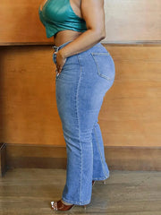 Plus size straight-leg jeans with mid-rise waist and zip-fly button closure