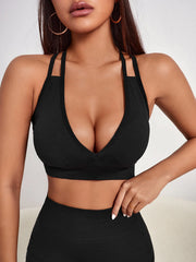 Black cross-strap sports bra with high-support fit
