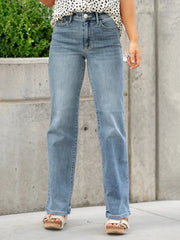 Faded light blue denim flare jeans styled casual and relaxed
