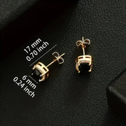 Gold-plated brass stud earrings with polished black cubic zirconia