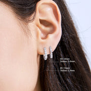Round brilliant-cut moissanite huggie earrings with secure claw setting